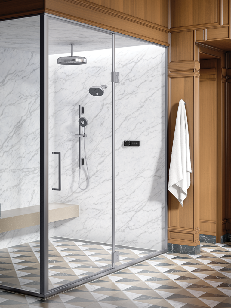 A scandinavian inspired enclosed shower with the Kohler Anthem digital thermostatic control. 