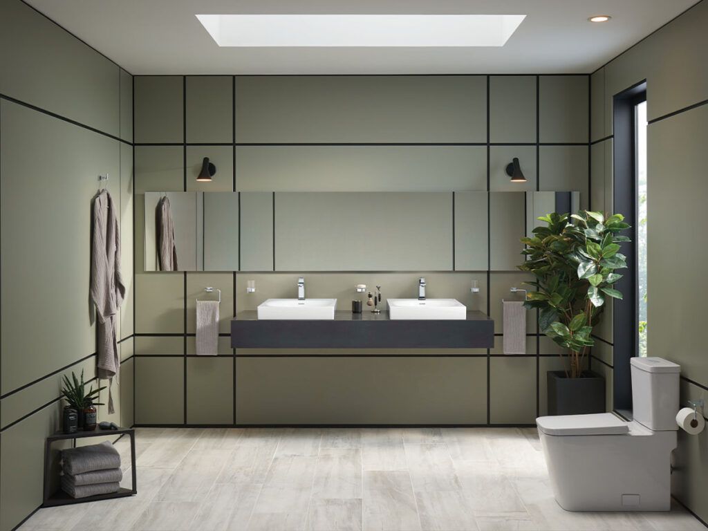 A green contemporary bath with square Grohe Euroocube fixtures and furniture.