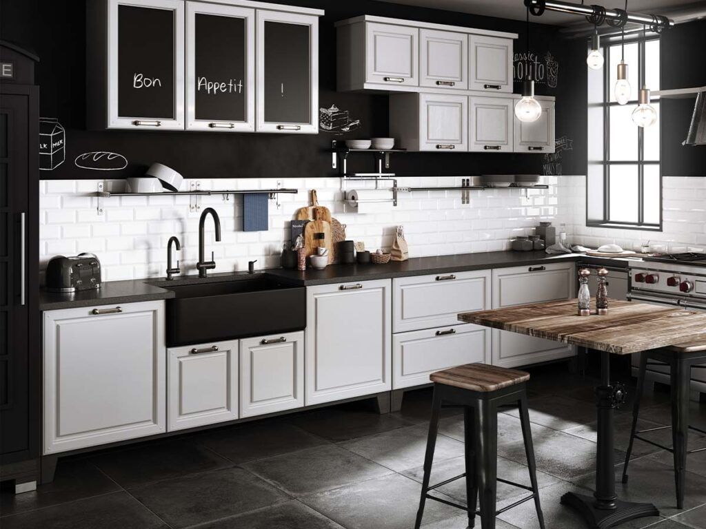 A black and white transitional kitchen with a black farmhouse sink.