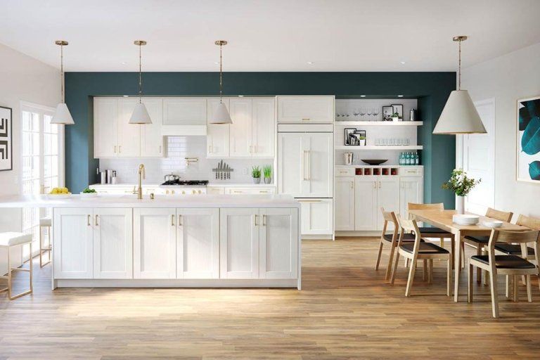 Light and airy transitional kitchen with semi-custom Waypoint brand cabinetry. Kitchen features white, shaker-style cabinet doors in Duraform Breeze style.