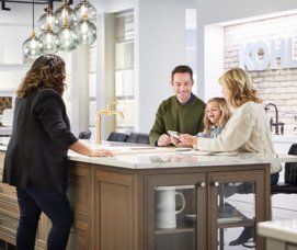 A kitchen and bath expert helps a family choose tile, accessories, lighting, and fixtures for their renovation project.