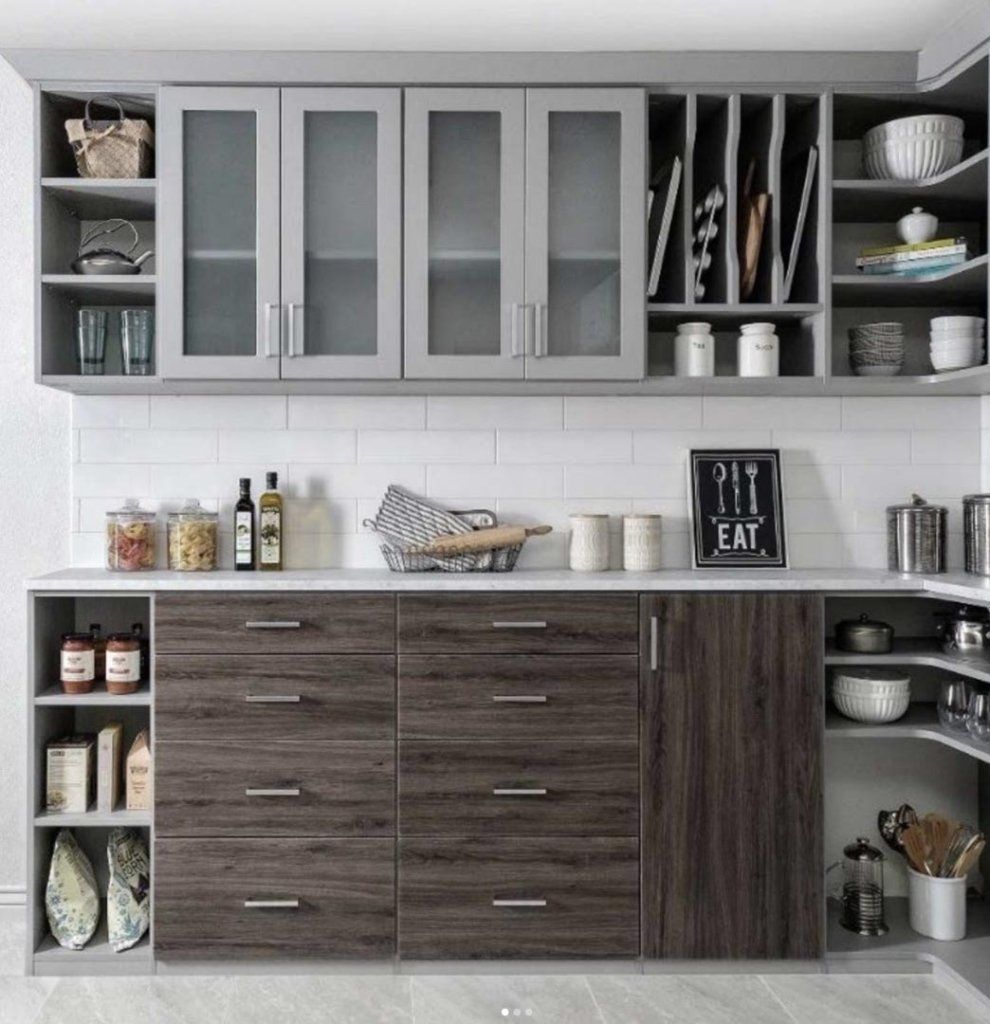 Sleek and organized kitchen pantry with gray and wood grain cabinetry. Featured cabinetry is Allure metro door style in mist supermatte and hoary oak
