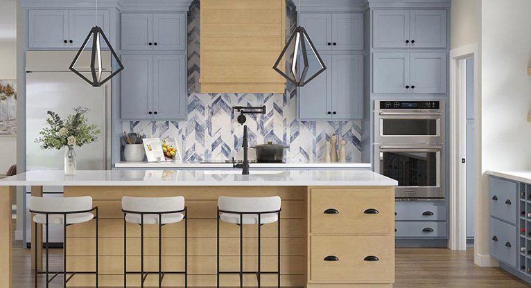header image for transitional cabinetry, featuring a light oak and blue cabinets