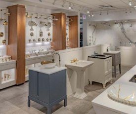 Angled shot of Kohler Hubbard's vanity sink's and shower set ups