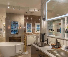 Angled shot of Kohler Hubbard showing the sinks and some bathroom displays