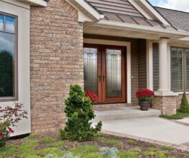 Double Allure entry doors with full length privacy decorative glass in art deco style.