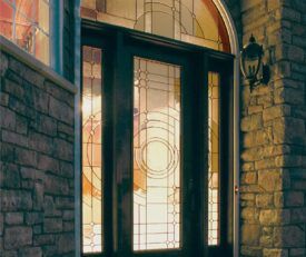 Allure entry door with full length privacy decorative glass in art deco style with side lites and arc window.