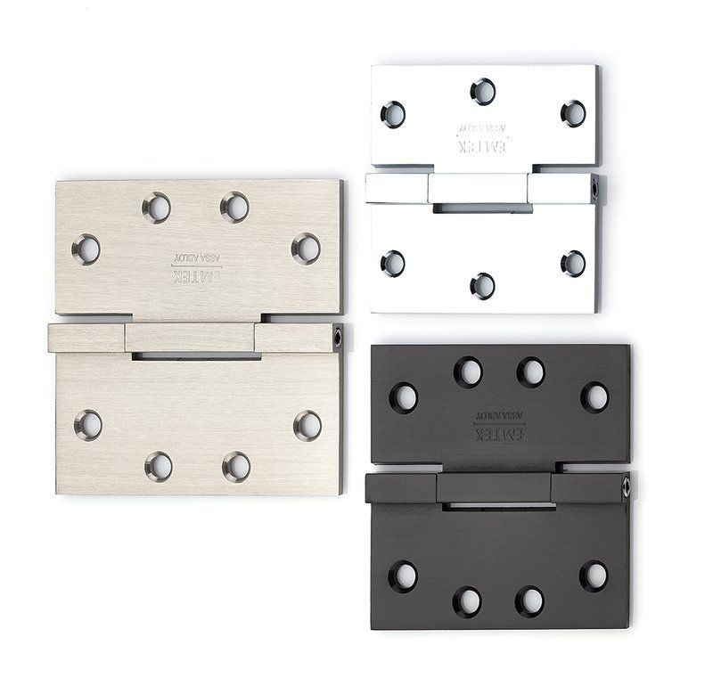 Opened hinges of varying build and finishes, featuring satin brass, chrome, and matte black hinges