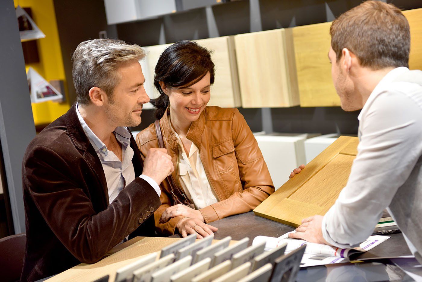 cabinet designer helping a couple plan their new kitchen